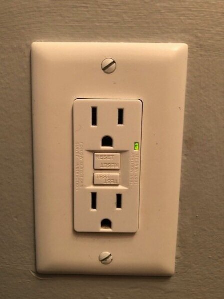 Or your GFCI plug may have white reset tabs